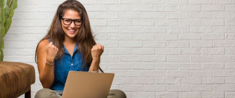 a woman excited after getting an online loan
