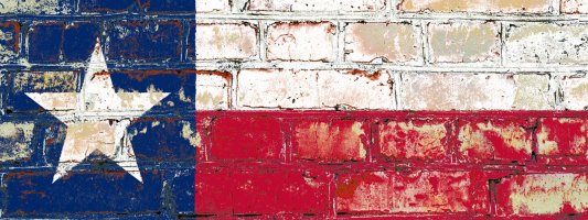 texas flag painted on brick wall